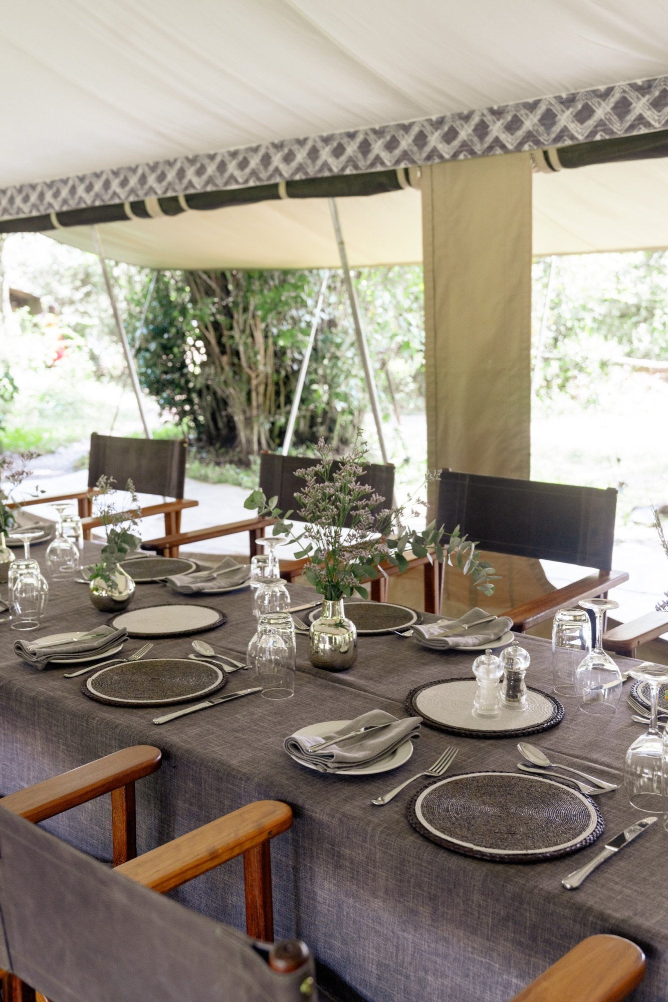 A table laid for dinner in a Ker & Downey mess tent